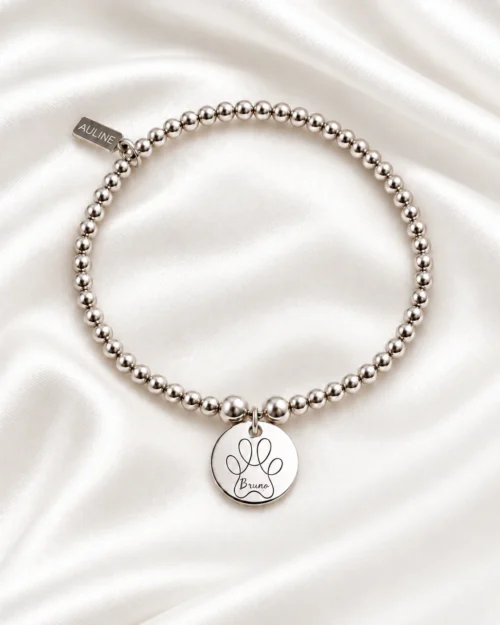 Pulsera Origen de bolas de plata de ley 925 con colgante redondo personalizable de 15 mm, grabado con un dibujo infantil, sobre tela satinada color crema